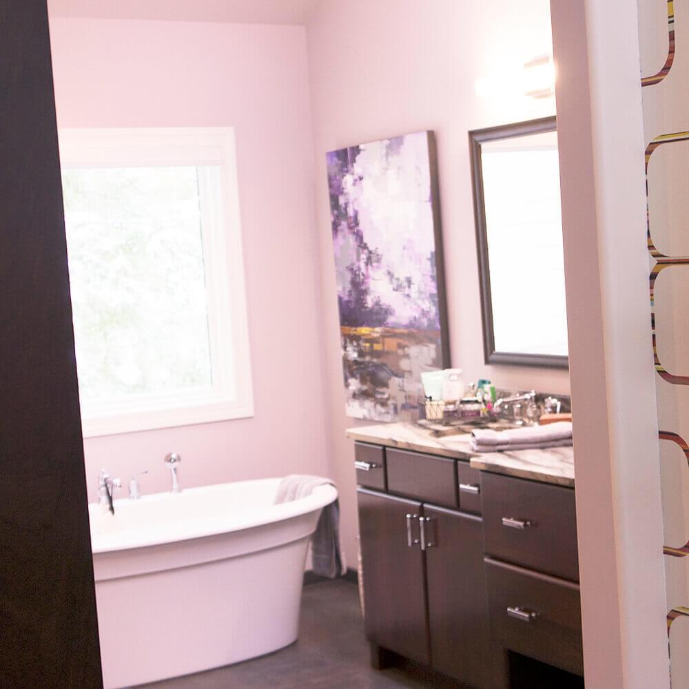 Light colored bathroom with raised bathtub