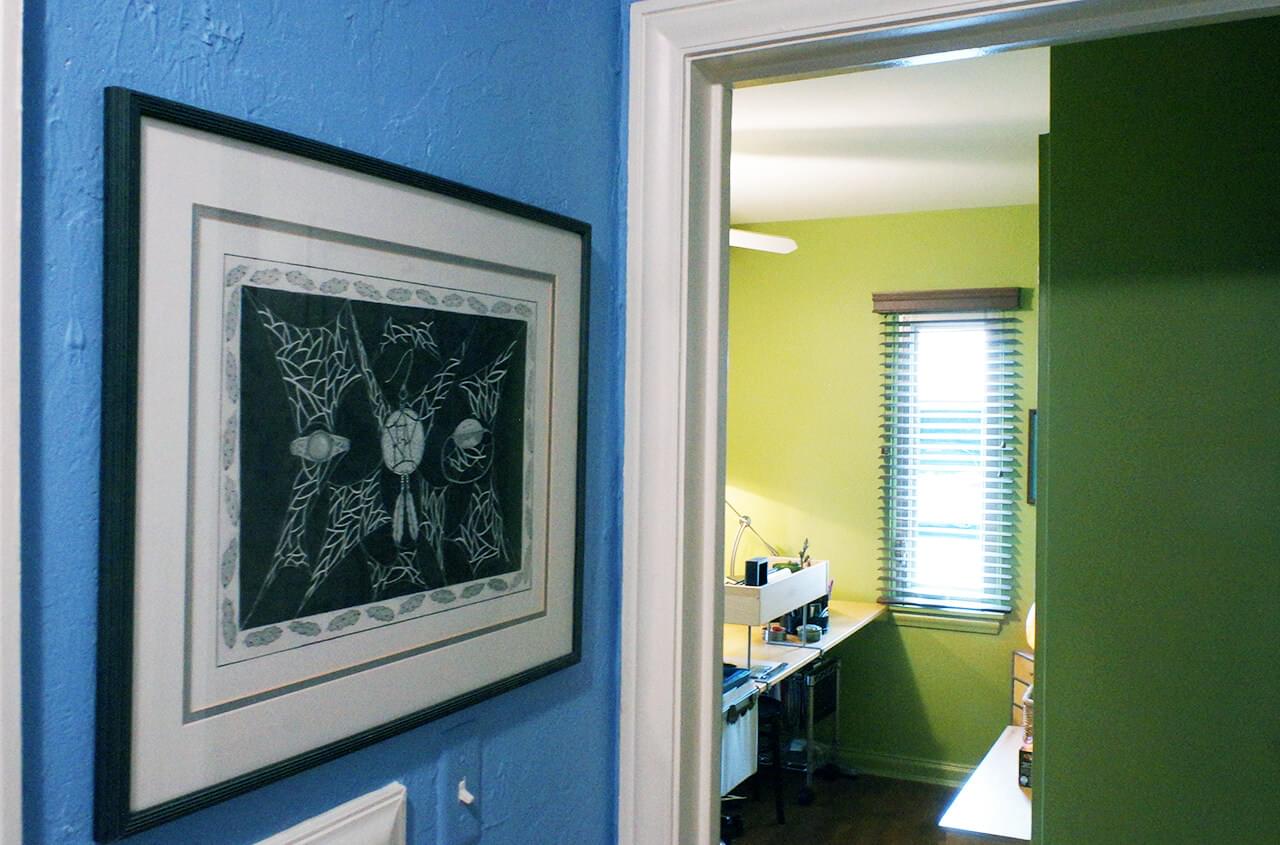 Entryway to home office with painting