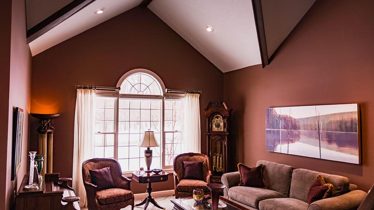 Living room with sofa, clock and two chairs