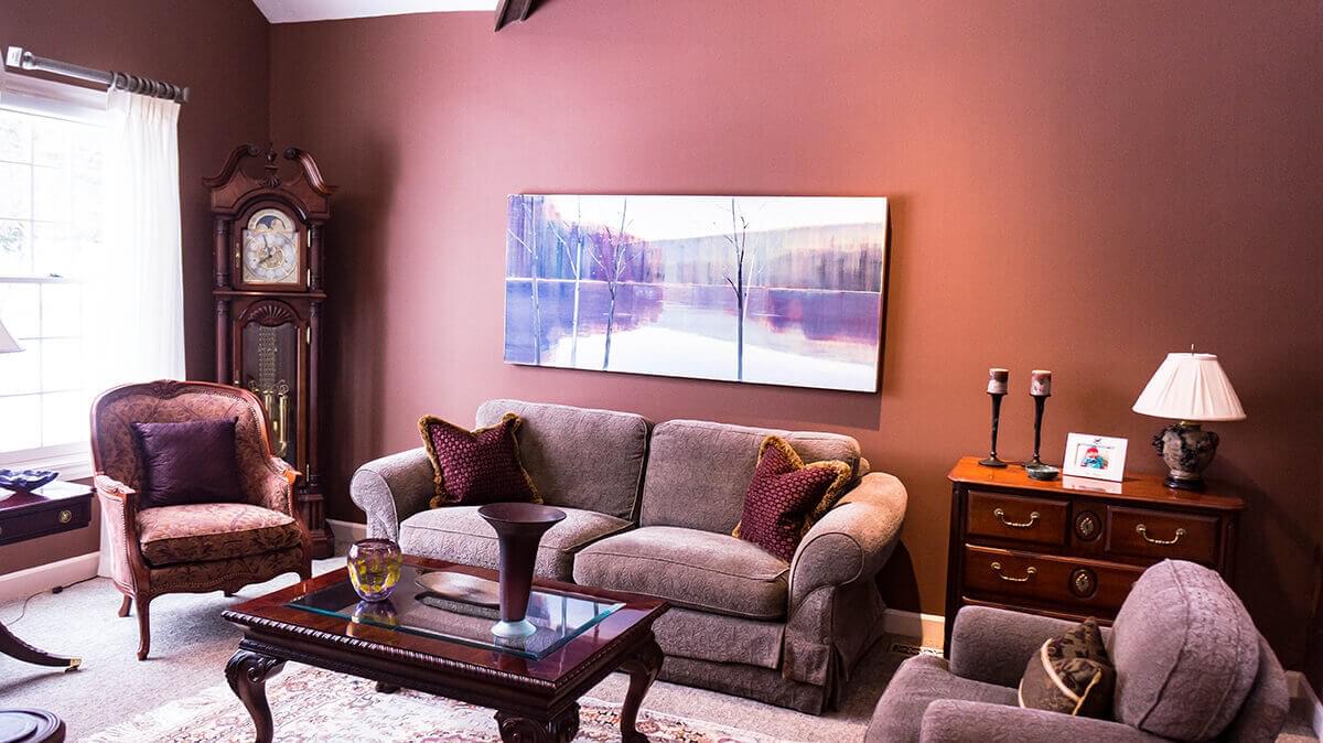 Living room with sofa, clock and two chairs